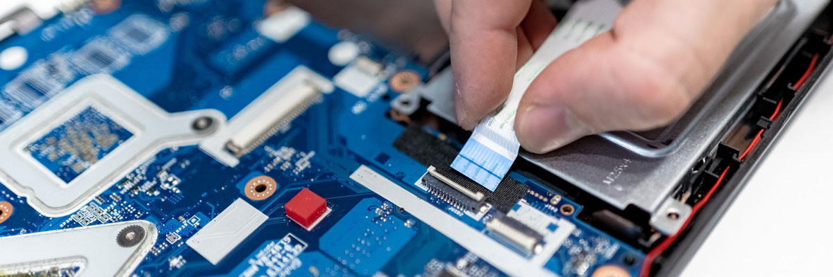 person fixing computer circuit board