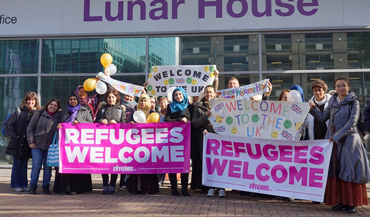lunar house welcome refugees group photo