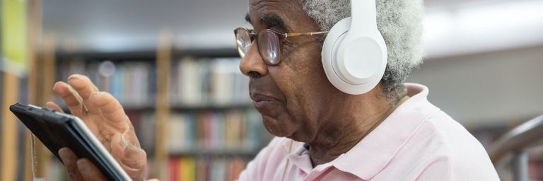 person wearing headphones in library