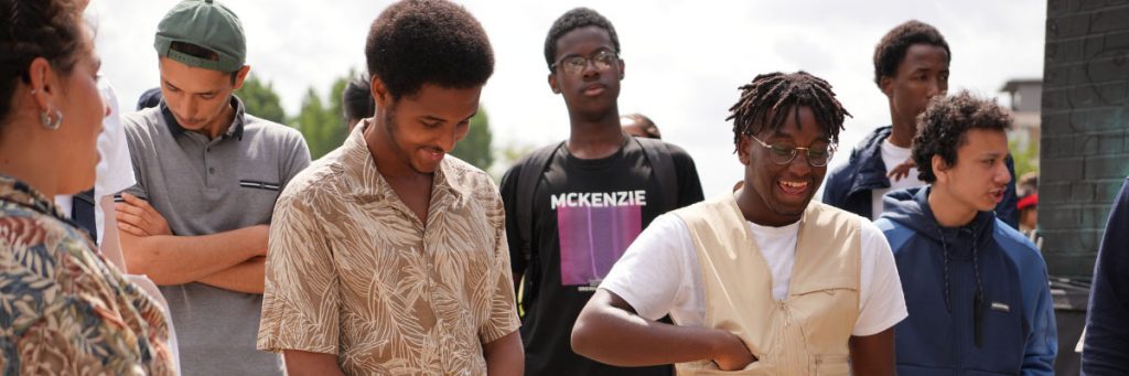ELATT Sixth Form learners laughing together on a short-film set.