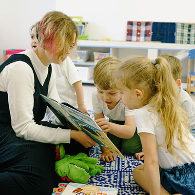 woman-reading-stories-to-children