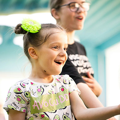 girl-laughing-with-carer