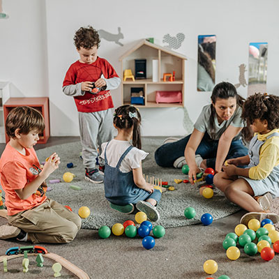 woman-taking-care-of-four-kids