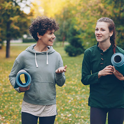two-people-laughing-and-talking-in-park