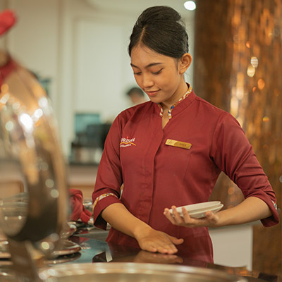 waiter-clearing-tables-while-smiling